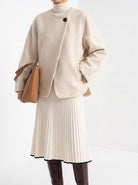 BLENIN collarless short coat in cream, styled detail