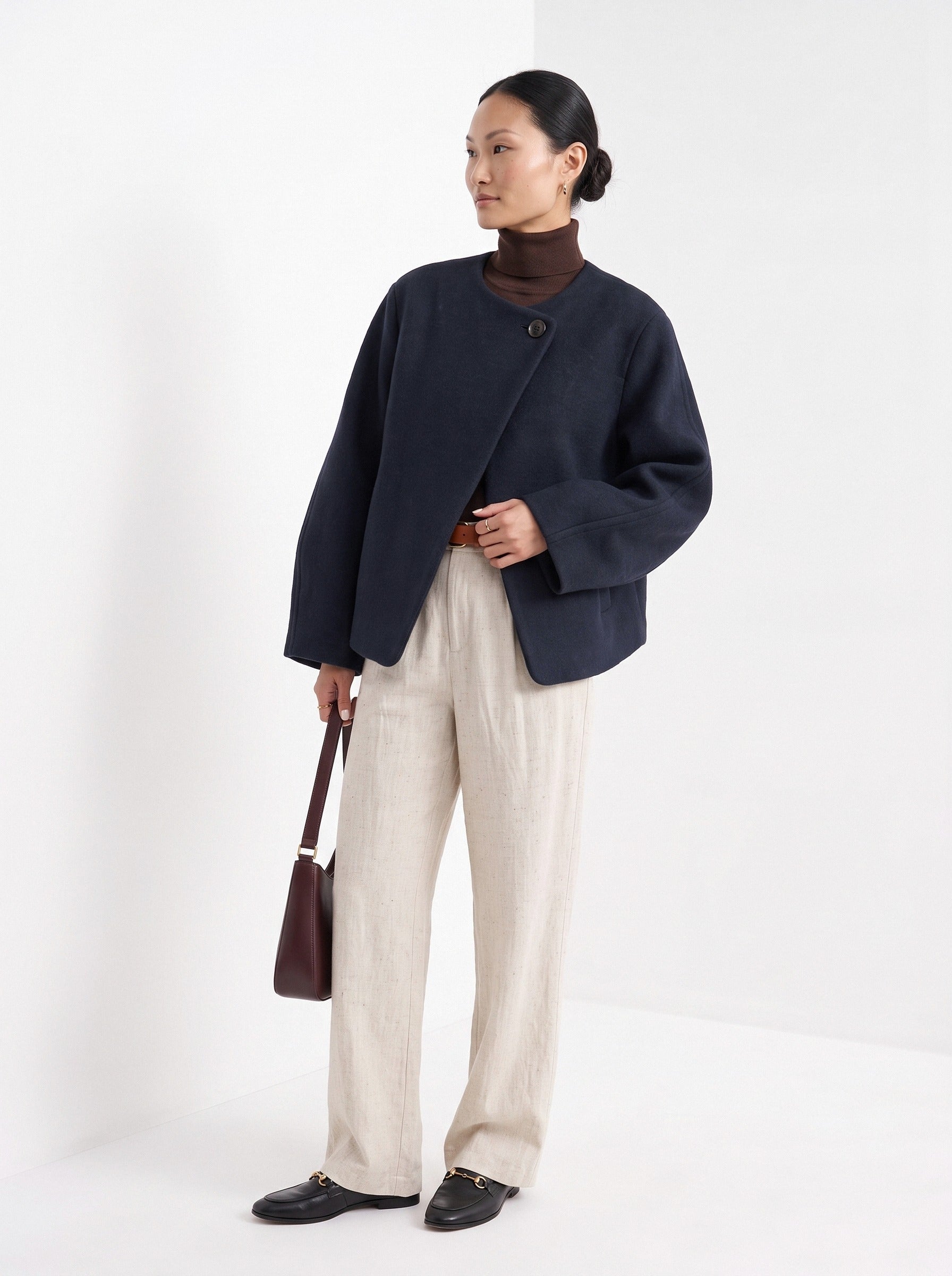 BLENIN collarless short coat in navy, three-quarter view