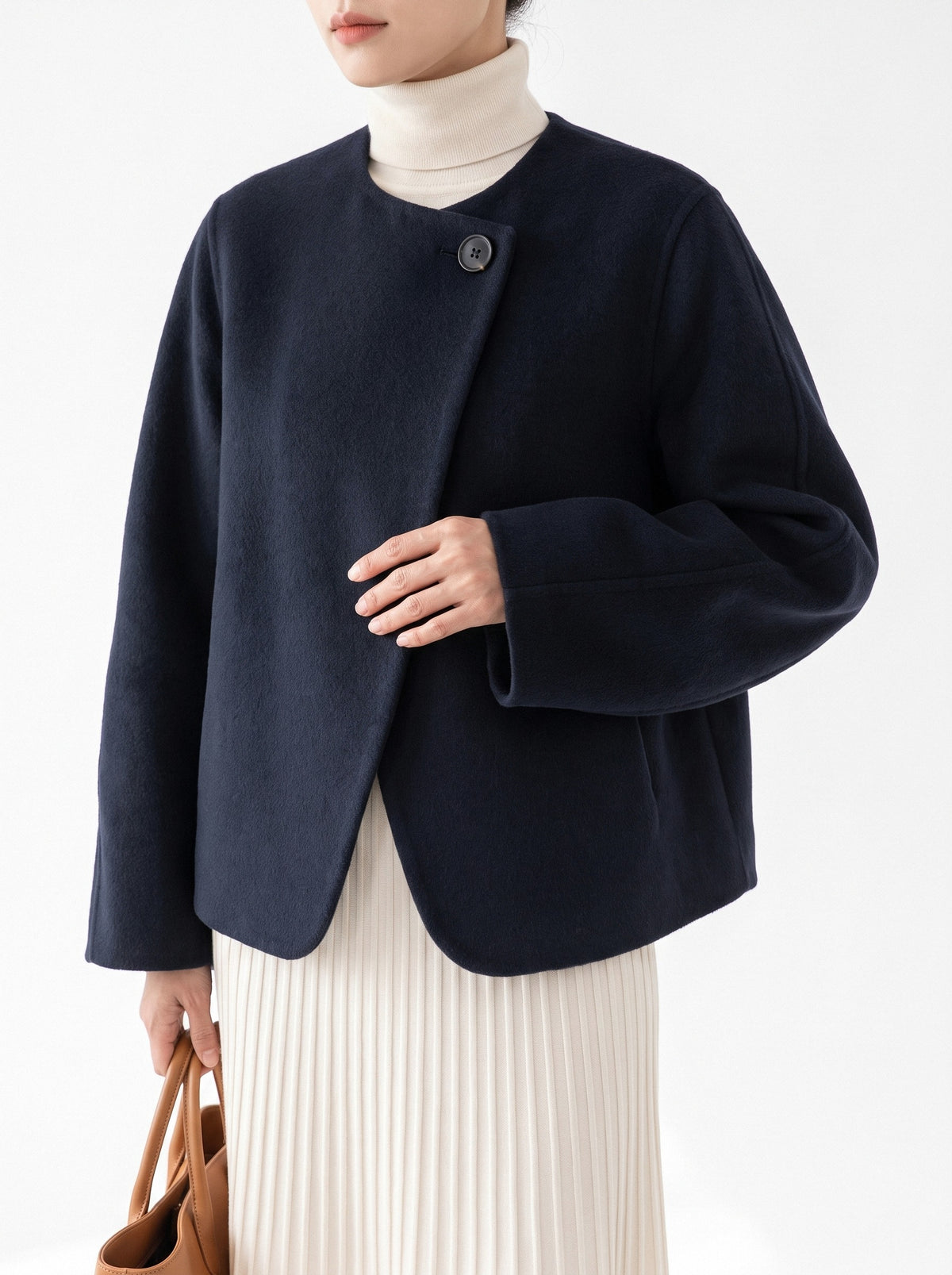 BLENIN collarless short coat in navy, close-up of the details