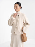 BLENIN collarless short coat in cream, front portrait