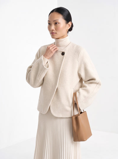 BLENIN collarless short coat in cream, front portrait