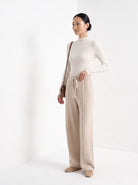 BLENIN knit wide leg trousers in beige, three-quarter view