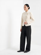 BLENIN herringbone wide leg trousers in black, three-quarter view