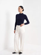 BLENIN satin wide leg trousers in white, three-quarter view
