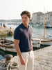 Navy fine cotton knit polo, worn on a harbour, short video