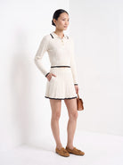 BLENIN women's cable knit polo skirt set in ivory, three-quarter view