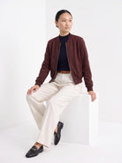BLENIN women's suede-look bomber jacket in burgundy, seated, full outfit